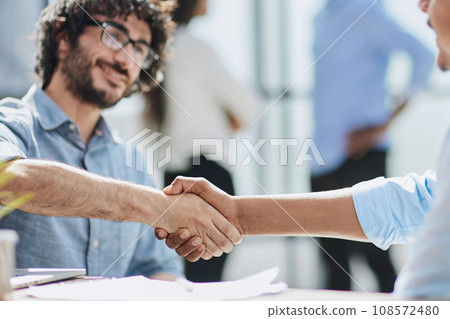 Successful Corporate Cooperation: Professional Business Partners at Indoor Office Meeting Successful Corporate Cooperation: Professional Business Partners at Indoor Office Meeting 108572480