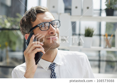 Man accountant or business lawyer talking on smartphone 108573088