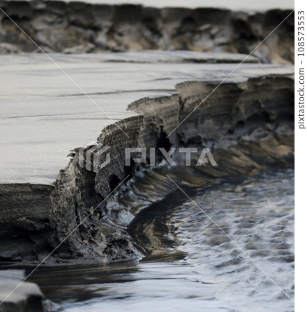 Sand pattern carved by spring water on the Kamaiso coast Sand pattern carved by spring water on the Kamaiso coast 108573553