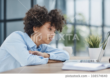 woman in the office sleeping at the workplace at the computer woman in the office sleeping at the workplace at the computer 108574640
