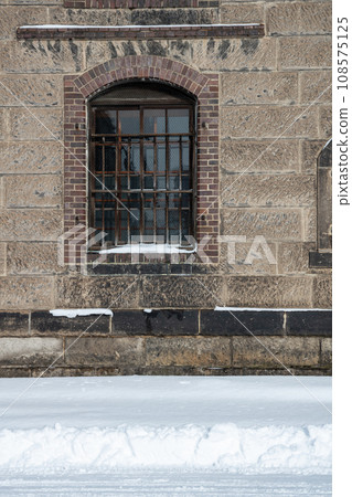 Window on the outer wall of the block warehouse Window on the outer wall of the block warehouse 108575125