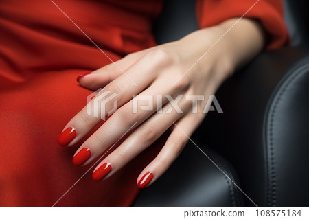 Glamour woman hand with classic red nail polish on her fingernails. Red nail manicure with gel polish at luxury beauty salon. Nail art and design. Female hand model. French manicure. Generative AI. 108575184