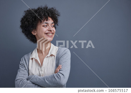 woman in the office uses the phone at the workplace at the computer woman in the office uses the phone at the workplace at the computer 108575517
