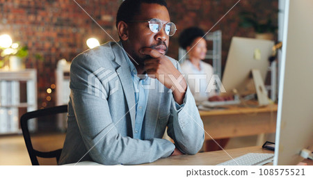 Business man, thinking and ideas on computer for office startup, financial decision and planning or solution at night. African worker for accounting research, web analysis and desktop problem solving 108575521