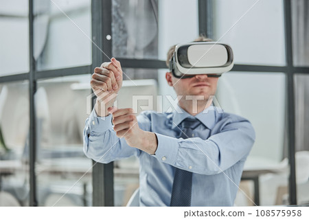 businessman in virtual reality headset in the office 108575958