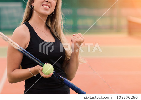 Tennis tournament. Female player at the clay tennis court Tennis tournament. Female player at the clay tennis court 108576266