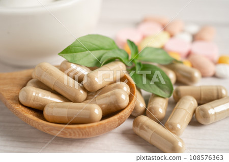 Alternative medicine herbal organic capsule with vitamin E omega 3 fish oil, mineral, drug with herbs leaf natural supplements for healthy good life. 108576363
