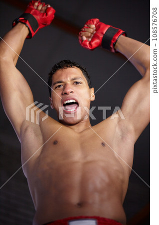 Celebration portrait, sports and MMA man scream, energy and cheers andfor gym achievement, success or kickboxing champion. Boxing winner, below view and boxer motivation, commitment and fight victory 108576708
