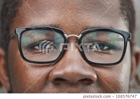 close-up of the face of a smiling African American man close-up of the face of a smiling African American man 108576747