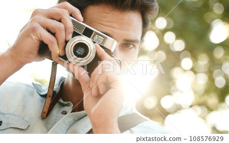 Camera, photography or face of man in park on holiday vacation trip for creativity, shooting or tourism memory. Photographer, travel or male tourist with pictures for sightseeing in nature in summer 108576929