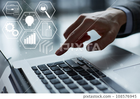 Close-up of male hands using laptop at office 108576945