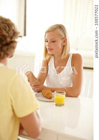 Breakfast, juice and a couple in their home in the morning together for love, health or nutrition. Food, romance or diet with a dating young man and woman eating a meal in their apartment for bonding Breakfast, juice and a couple in their home in the morning together for love, health or nutrition. Food, romance or diet with a dating young man and woman eating a meal in their apartment for bonding 108577022