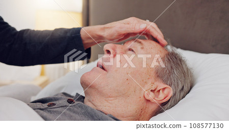 Elderly woman caring her husband in bed with love, care and marriage at modern home together. Sick, recover and senior couple in retirement with illness in bedroom of hospice, nursing center or house 108577130