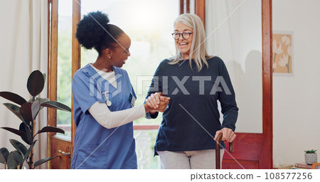 Senior woman, nurse and help with walking stick for rehabilitation, wellness and talk with smile. African caregiver, happy patient and elderly person with disability, cane and support for recovery 108577256