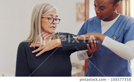 Physical therapy, senior woman and injury check at a retirement home for wellness and healthy. Medical, worker and caregiver with elderly consultation at clinic with help and support of chiropractor Physical therapy, senior woman and injury check at a retirement home for wellness and healthy. Medical, worker and caregiver with elderly consultation at clinic with help and support of chiropractor 108577358