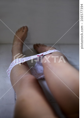 Woman, underwear and legs for sexual abuse, floor and person with trauma, crime or hurt. Body, vulnerable and harassment with pain, naked and helpless with suffering, prisoner and hostage victim Woman, underwear and legs for sexual abuse, floor and person with trauma, crime or hurt. Body, vulnerable and harassment with pain, naked and helpless with suffering, prisoner and hostage victim 108577394