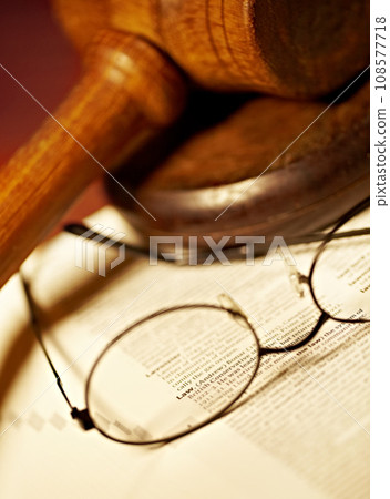 Law table, document and glasses for jury, notes or work in the courtroom. Paperwork, knowledge and eyewear on an attorney desk for order, legal job or advocate trial for a judgment or crime defense 108577718