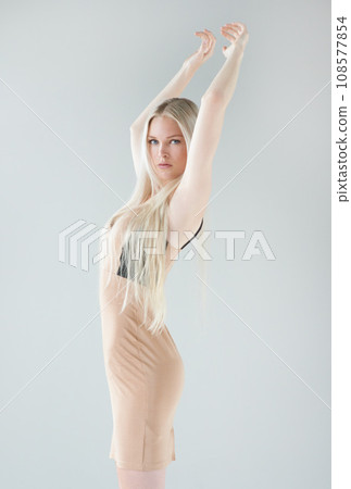 Woman, fashion clothes and portrait with glamour style, beauty and confidence in a studio. Grey background, female person and model from Russia with trendy couture and makeup with elegant dress 108577854