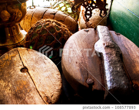 Closeup of fishing barrels, lines and rope, net and storage of traditional equipment at port. Tools, fishery and mesh, vintage wood and old metal, retro cordage and antique fishnet in industry Closeup of fishing barrels, lines and rope, net and storage of traditional equipment at port. Tools, fishery and mesh, vintage wood and old metal, retro cordage and antique fishnet in industry 108577893