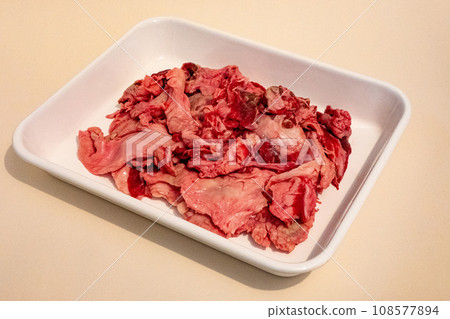 Raw beef tendon in an enamel vat Raw beef tendon in an enamel vat 108577894