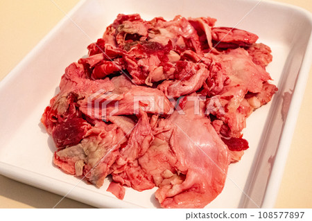 Raw beef tendon in an enamel vat Raw beef tendon in an enamel vat 108577897