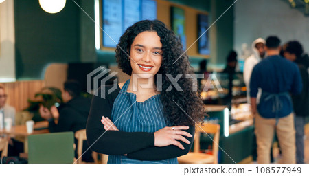 Waitress, woman and portrait with arms crossed or happy for service, welcome or server in coffee shop. Barista, person and face with smile for hospitality, career or confidence in restaurant or cafe Waitress, woman and portrait with arms crossed or happy for service, welcome or server in coffee shop. Barista, person and face with smile for hospitality, career or confidence in restaurant or cafe 108577949
