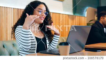 Woman, computer and video call in cafe for remote work, online meeting and planning or networking for job opportunity. Freelancer talking on laptop for virtual discussion at restaurant or coffee shop 108578170
