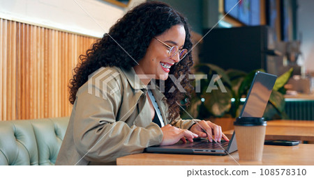 Happy woman in coffee shop, typing on computer and remote work, reading email or writing blog, article or search on internet. Laptop, freelancer and copywriting in cafe, smile at restaurant or table Happy woman in coffee shop, typing on computer and remote work, reading email or writing blog, article or search on internet. Laptop, freelancer and copywriting in cafe, smile at restaurant or table 108578310