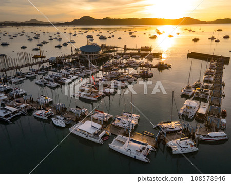 Aerial view of Chalong Pier during sunrise in Phuket, Thailand Aerial view of Chalong Pier during sunrise in Phuket, Thailand 108578946
