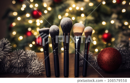 AI-generated content. Set of make up brushes near Christmas tree, bokeh background with copy space. 108579558