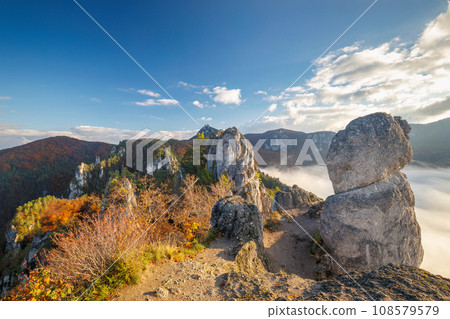 Mountain landscape with foggy valley during autumn morning. 108579579