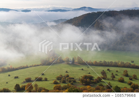 Mountain rocky landscape in autumn foggy morning. Mountain rocky landscape in autumn foggy morning. 108579668