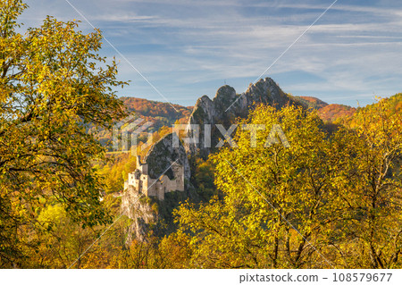 View of autumn landscape with The Lednica medieval castle. 108579677