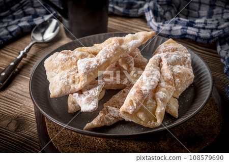 Faworki - traditional Polish crispy dessert. Faworki - traditional Polish crispy dessert. 108579690