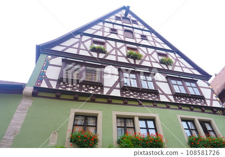 The fragment or detail of historical building at Rothenburg ob der Tauber where is the fortified city at Germany. 108581726