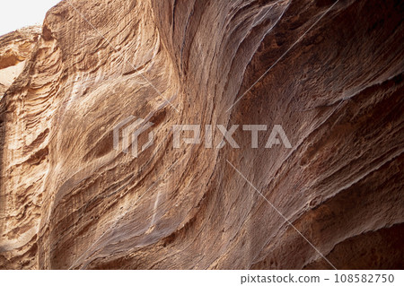 Kayon Sik. Close-up of the intricately shaped canyon walls and winding road. Petra Jordan 108582750