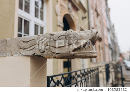 Head of dragon as decoration on old street in Gdansk, Poland 108583282