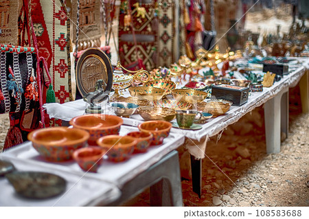 View of an open-air souvenir shop located along the Siq Canyon in the city of Petra, Jordan. View of an open-air souvenir shop located along the Siq Canyon in the city of Petra, Jordan. 108583688