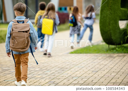 Kids getting out of the school after the lessons Kids getting out of the school after the lessons 108584343