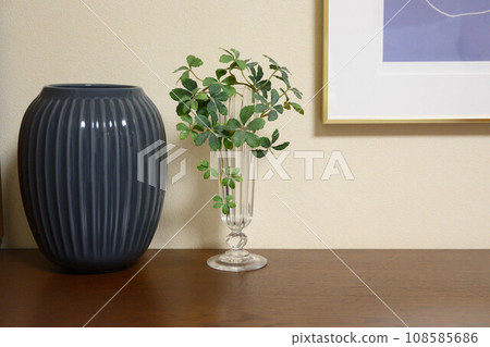 A vase to decorate on the living board. light and its shadow. Display your own photos inside. Access to a calm living room A vase to decorate on the living board. light and its shadow. Display your own photos inside. Access to a calm living room 108585686