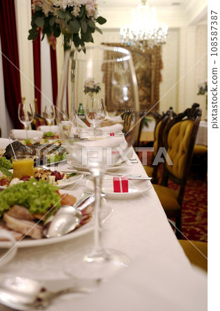Glasses with wine. Filled with half and stand on the holiday table. restaurant. selective focus 108587387