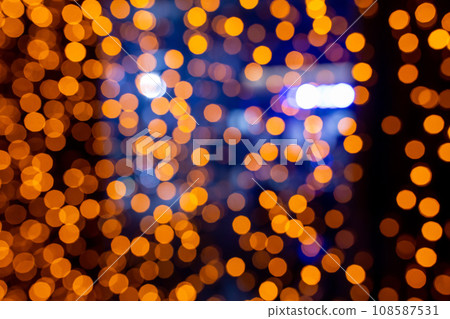 Abstract circular bokeh background of Christmaslight. bokeh from garlands. background for screensaver. Defocused lights. Blurred bokeh with yellow color lights. Abstract circular bokeh background of Christmaslight. bokeh from garlands. background for screensaver. Defocused lights. Blurred bokeh with yellow color lights. 108587531