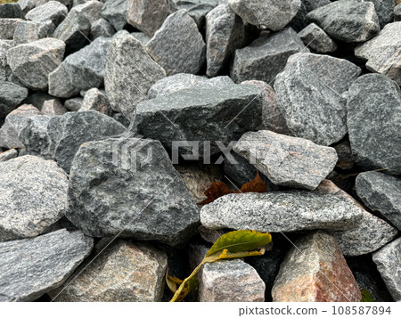 Grey crushed stones in close up. Building material for horticulture, landscape gardening or road 108587894