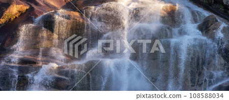 Waterfall rushing down the rocks. Sunset. Shannon Falls, Squamish, BC, Canada. 108588034