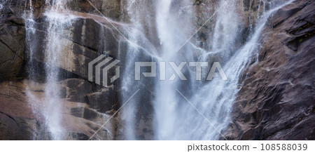 Waterfall rushing down the rocks. Sunset. Shannon Falls, Squamish, BC, Canada. 108588039
