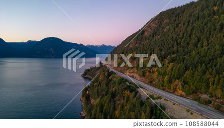 Sea to Sky Highway on West Coast of Pacific Ocean. Aerial Mountain Landscape. Twilight sky. 108588044
