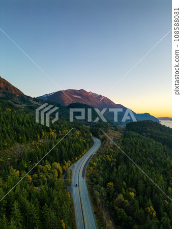 Sea to Sky Highway on West Coast of Pacific Ocean. Aerial Mountain Landscape. Twilight sky. 108588081