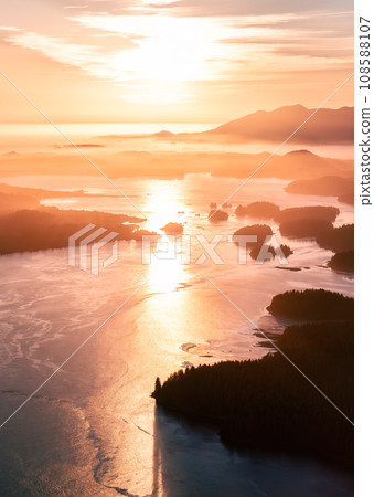 Rocky Shore on the Pacific Ocean Coast in Tofino, Vancouver Island, BC, Canada. Sunset. Aerial 108588107