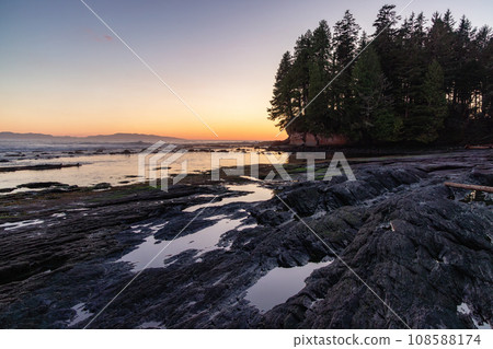 Rocky Shore on the Pacific Ocean Coast. Sunny Sunset. Nature Background Rocky Shore on the Pacific Ocean Coast. Sunny Sunset. Nature Background 108588174