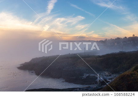 Scenic View of the Coastline on the West Pacific Ocean Coast. Foggy Sunset. 108588224